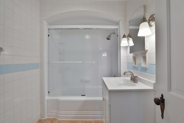 bathroom featuring vanity and shower / tub combination