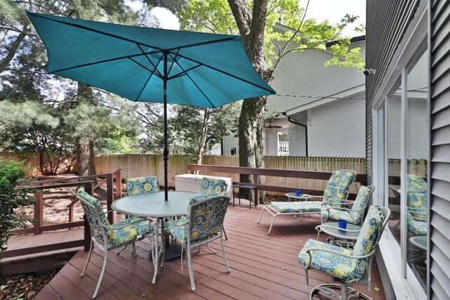wooden deck with fence and outdoor dining area