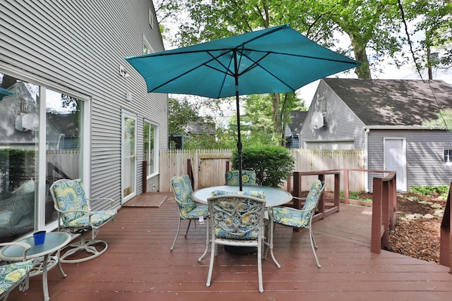 wooden deck featuring fence and outdoor dining area