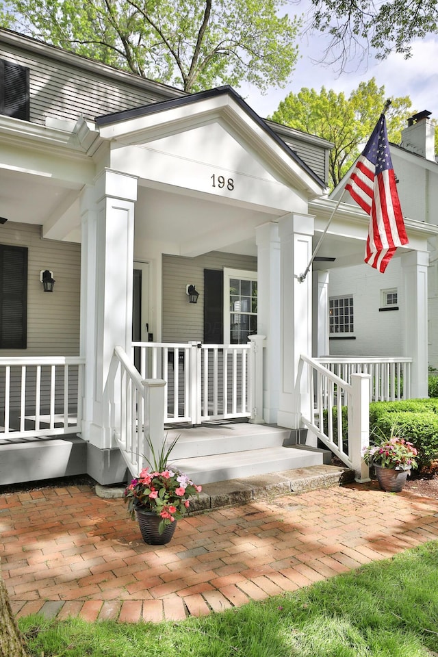 doorway to property with covered porch