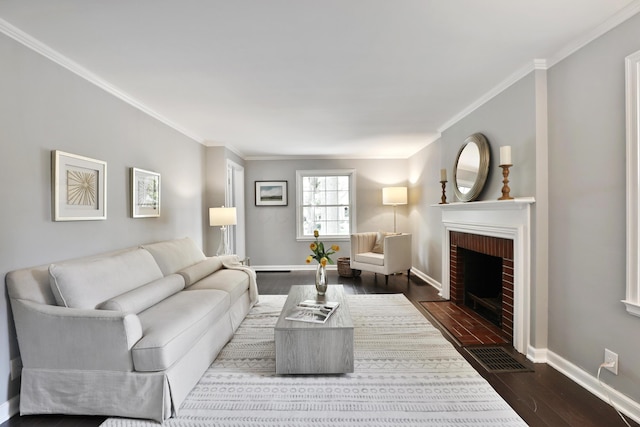 living room featuring dark wood-type flooring, crown molding, a brick fireplace, and baseboards