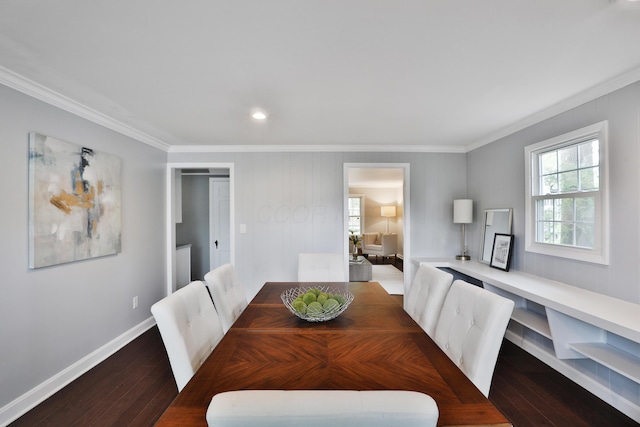 dining space with crown molding, wood finished floors, baseboards, and recessed lighting