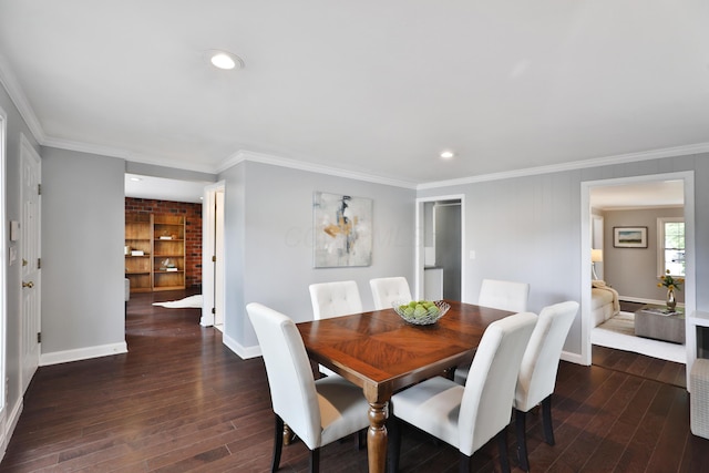 dining area with baseboards, dark wood finished floors, recessed lighting, and crown molding