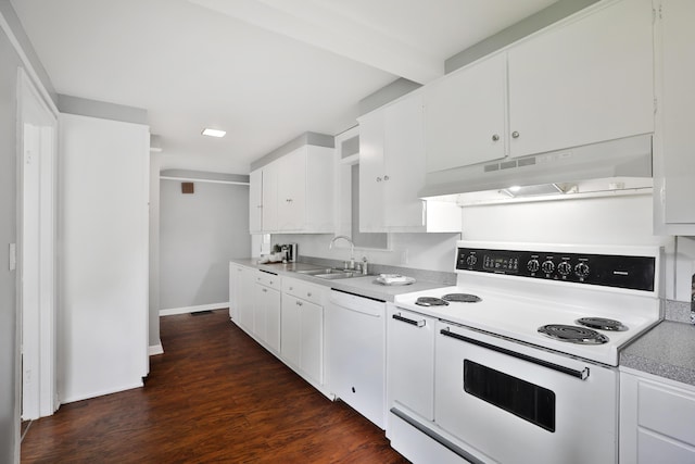 kitchen with white appliances, under cabinet range hood, a sink, dark wood-style floors, and baseboards