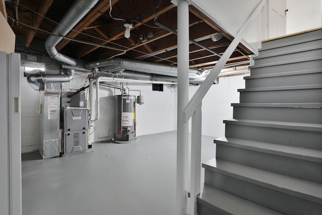 unfinished basement with gas water heater, stairs, and heating unit