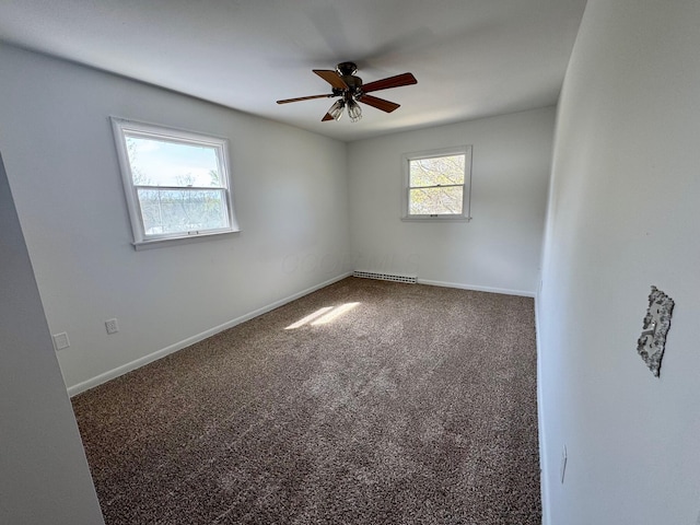 25 N Liberty St, New Concord, OH 43762 - carpeted spare room featuring baseboards and a ceiling fan