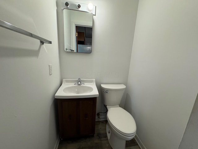 25 N Liberty St, New Concord, OH 43762 - half bathroom with toilet, vanity, and baseboards