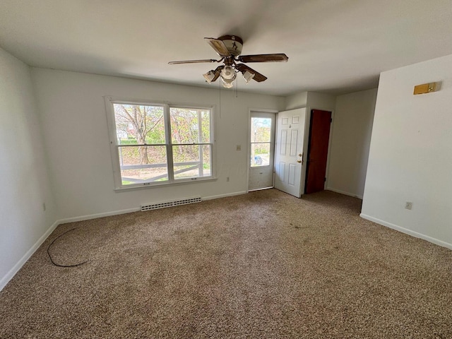 25 N Liberty St, New Concord, OH 43762 - unfurnished room featuring baseboards, visible vents, a ceiling fan, and carpet floors