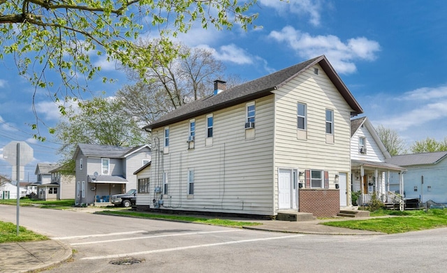 view of side of home featuring a chimney