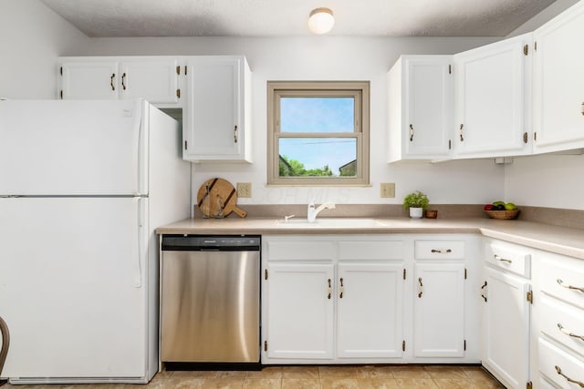 kitchen featuring dishwasher, freestanding refrigerator, a sink, white cabinetry, and light countertops
