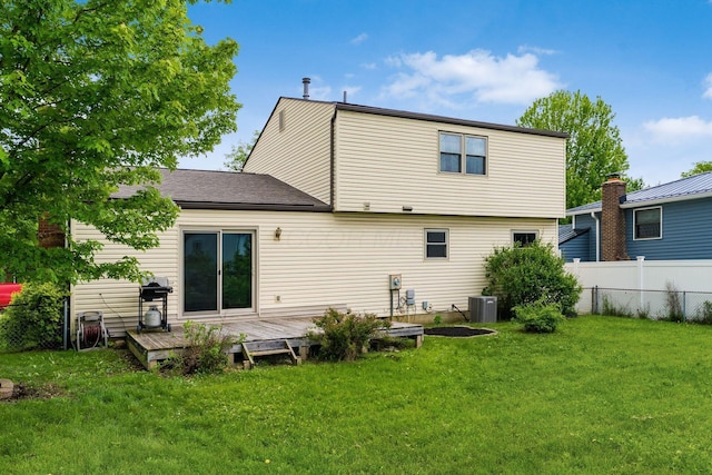 rear view of property with central AC and a wooden deck