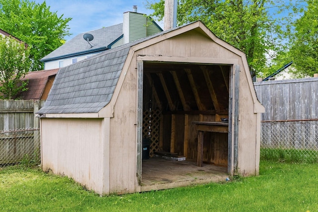 view of shed with fence