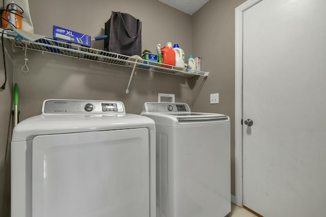 washroom featuring laundry area and independent washer and dryer