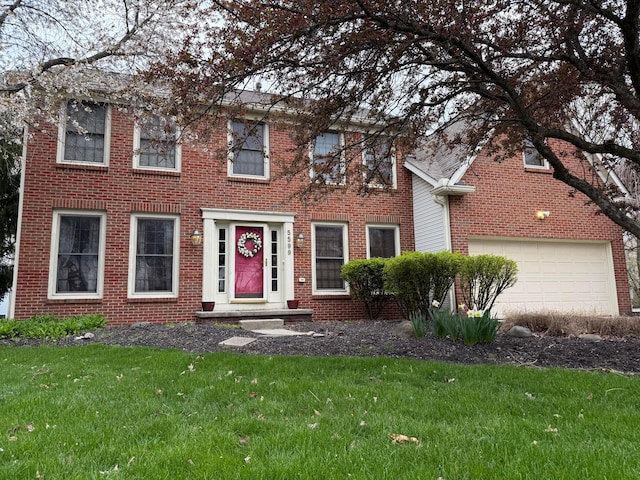 5599 Dublinshire Dr, Dublin, OH 43017 - colonial home with a garage, brick siding, and a front lawn