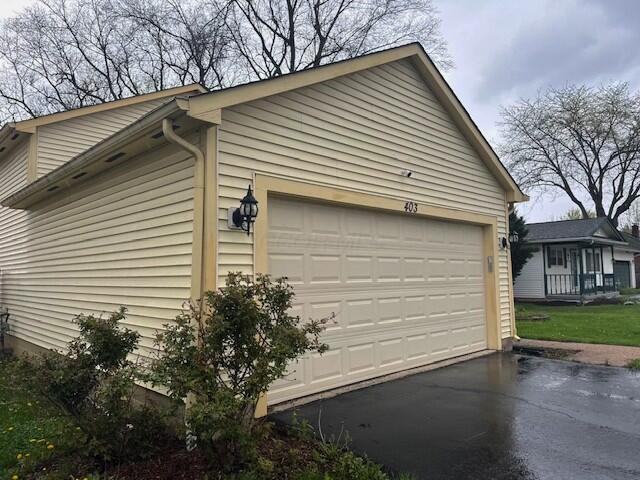 garage featuring aphalt driveway