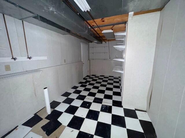 unfinished basement with tile patterned floors