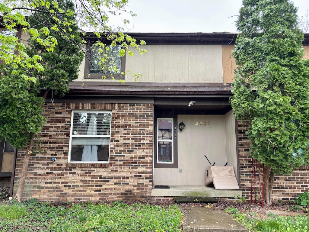view of front of house featuring brick siding