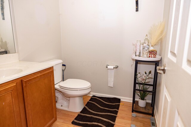 105 Autumn Ter SW, Etna, OH 43062 - half bath with vanity, baseboards, toilet, and wood finished floors