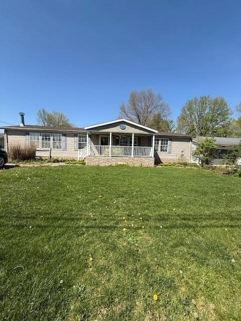 view of front of house with a porch and a front yard