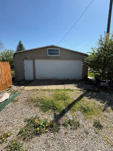 detached garage with fence