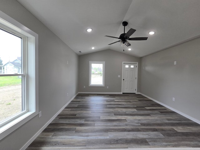 interior space featuring a ceiling fan, recessed lighting, dark wood finished floors, and lofted ceiling