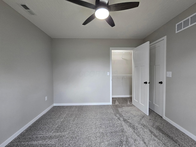unfurnished bedroom featuring a closet, baseboards, carpet flooring, and visible vents