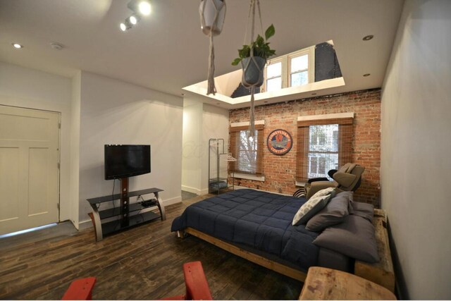 1033 Franklin Ave, Columbus, OH 43205 - bedroom with brick wall, wood finished floors, baseboards, a towering ceiling, and recessed lighting