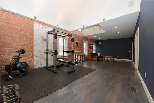 1033 Franklin Ave, Columbus, OH 43205 - exercise area with wood finished floors, baseboards, and brick wall