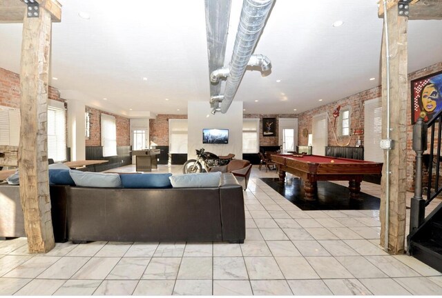 1033 Franklin Ave, Columbus, OH 43205 - living room with billiards table, brick wall, and plenty of natural light