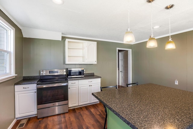 kitchen with visible vents, dark countertops, white cabinets, appliances with stainless steel finishes, and dark wood finished floors