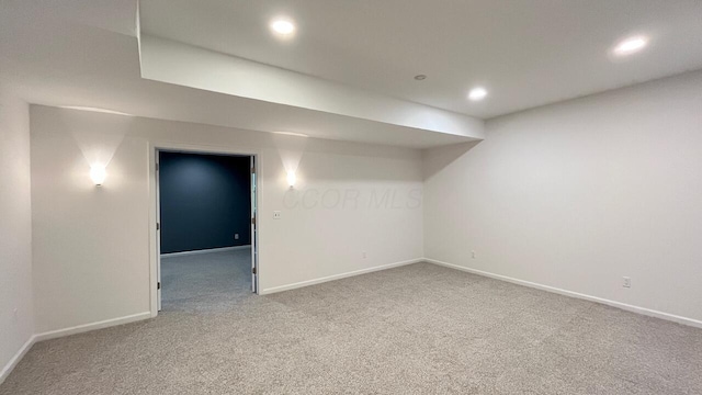 finished basement with carpet floors, baseboards, and recessed lighting