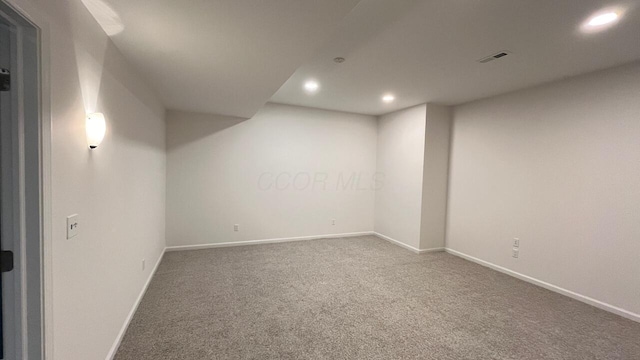 finished basement featuring recessed lighting, carpet, and baseboards
