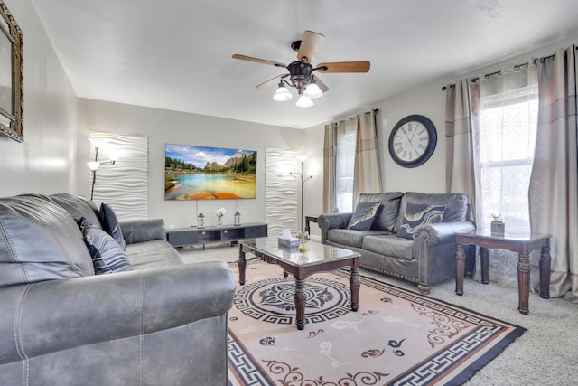 living room featuring carpet flooring and ceiling fan