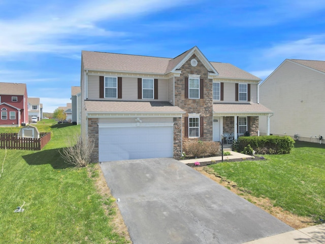 view of front of property with a front yard, a garage, driveway, stone siding, and fence