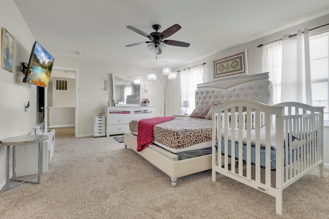 bedroom featuring baseboards, visible vents, ceiling fan, and carpet floors
