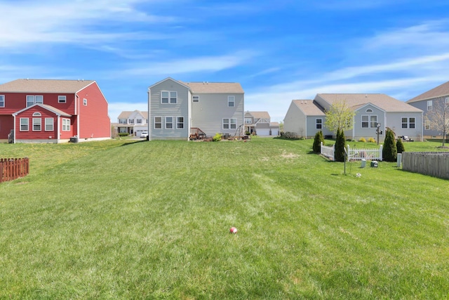 view of yard with fence and a residential view