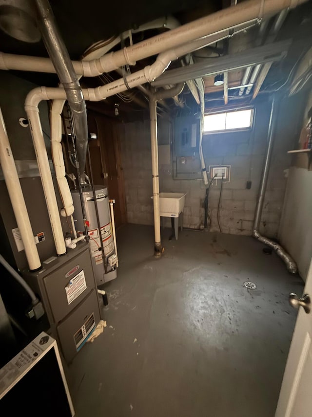 basement with water heater, electric panel, and a sink
