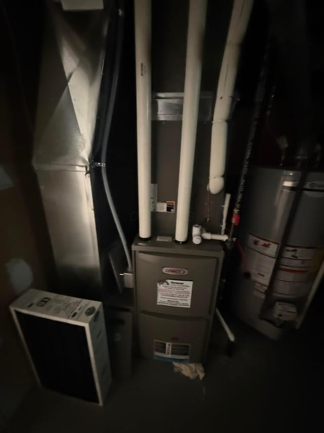 utility room featuring gas water heater