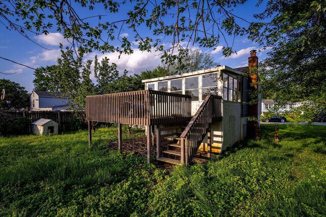 2987 Olivette Rd, Columbus, OH 43232 - rear view of house featuring stairway, a sunroom, a wooden deck, a chimney, and fence