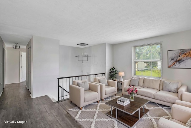 2987 Olivette Rd, Columbus, OH 43232 - living area with wood finished floors and a textured ceiling