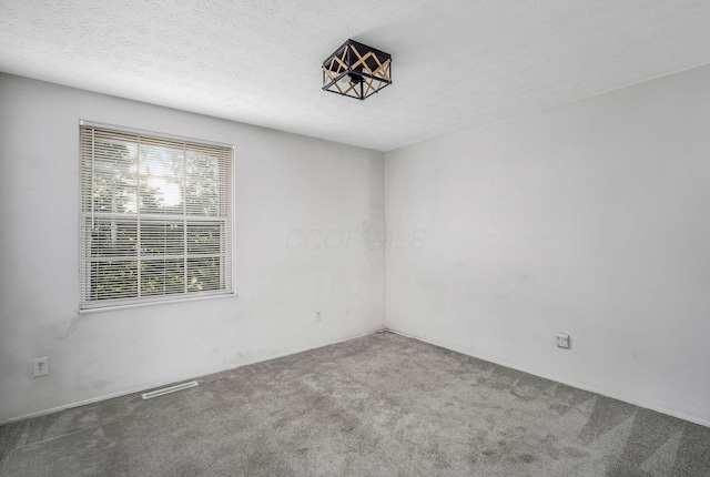 2987 Olivette Rd, Columbus, OH 43232 - carpeted empty room featuring a textured ceiling