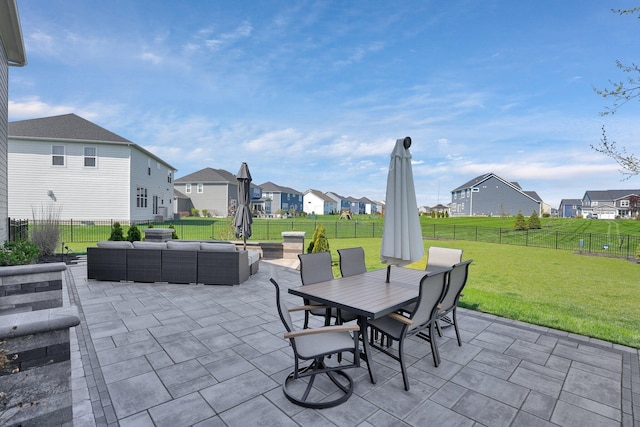 view of patio / terrace with a residential view, outdoor dining area, an outdoor living space, and a fenced backyard