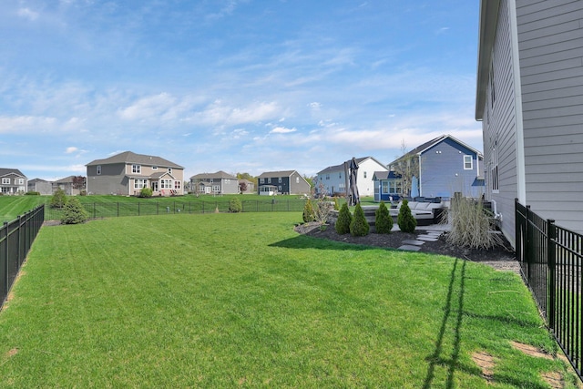 view of yard featuring a residential view and a fenced backyard