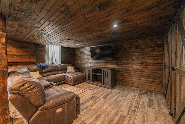 living room with wooden walls, wood ceiling, and wood finished floors