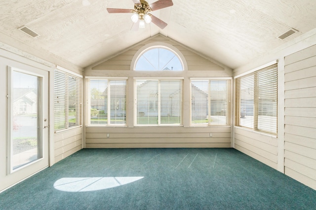 unfurnished sunroom featuring carpet floors, ceiling fan, lofted ceiling, and visible vents