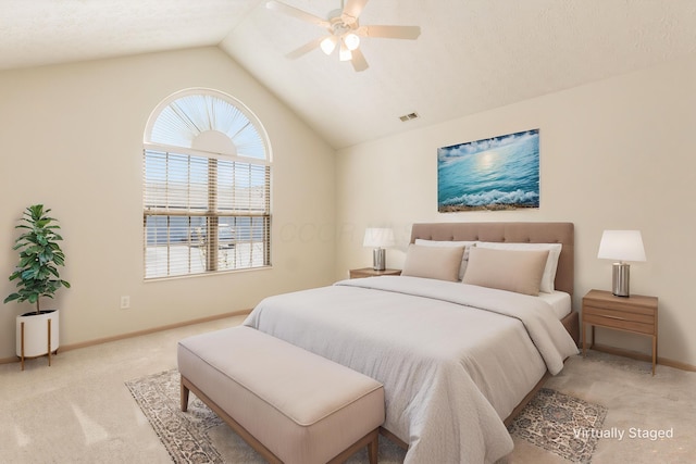 carpeted bedroom featuring baseboards, visible vents, ceiling fan, and lofted ceiling