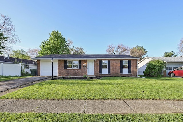 ranch-style house featuring aphalt driveway, a garage, brick siding, fence, and a front lawn