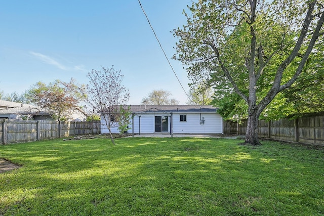 view of yard featuring a patio and a fenced backyard