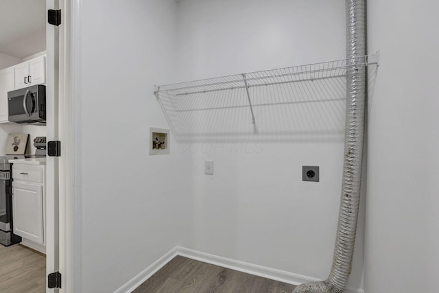 clothes washing area featuring electric dryer hookup, baseboards, hookup for a washing machine, dark wood finished floors, and laundry area