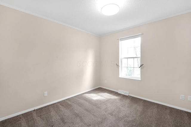 7320 Partridge Dr, Dublin, OH 43016 - spare room featuring ornamental molding, visible vents, carpet, and baseboards